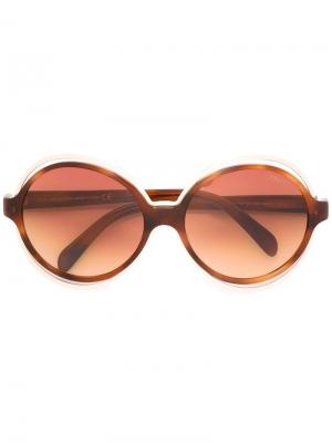 Солнцезащитные очки в круглой оправе Emilio Pucci. Цвет: коричневый